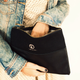 Image for article titled A Sturdy Black Clutch That Holds Almost Anything